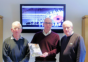 Steve and John present Nigel Stevens of the CWGC with the Chorley Pals book